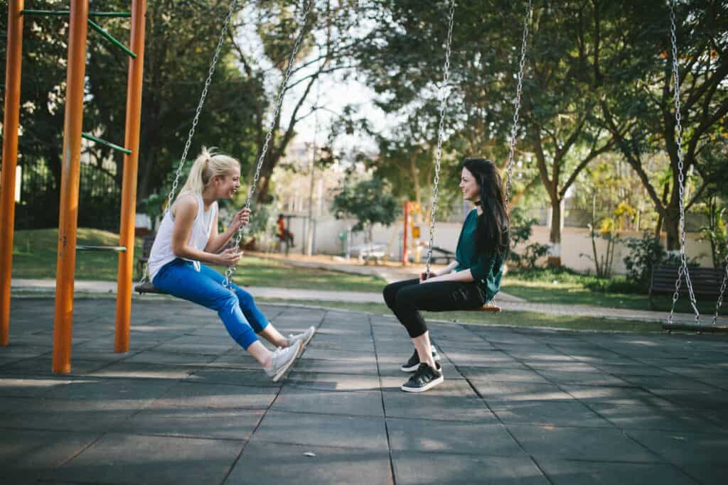 Friends swinging and talking about women self care