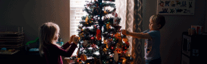 Kids decorating a Christmas tree