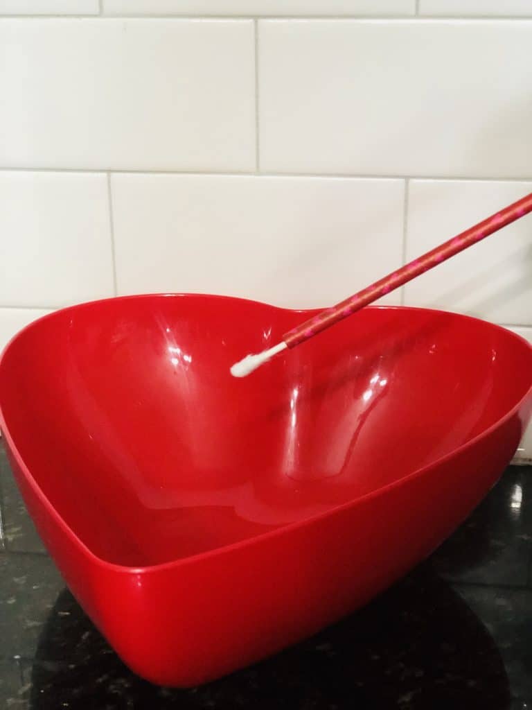 heart shaped bowl with straw and q-tip for Q-pid game 
