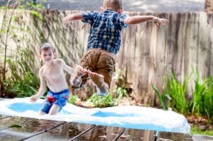 kids playing in water outside