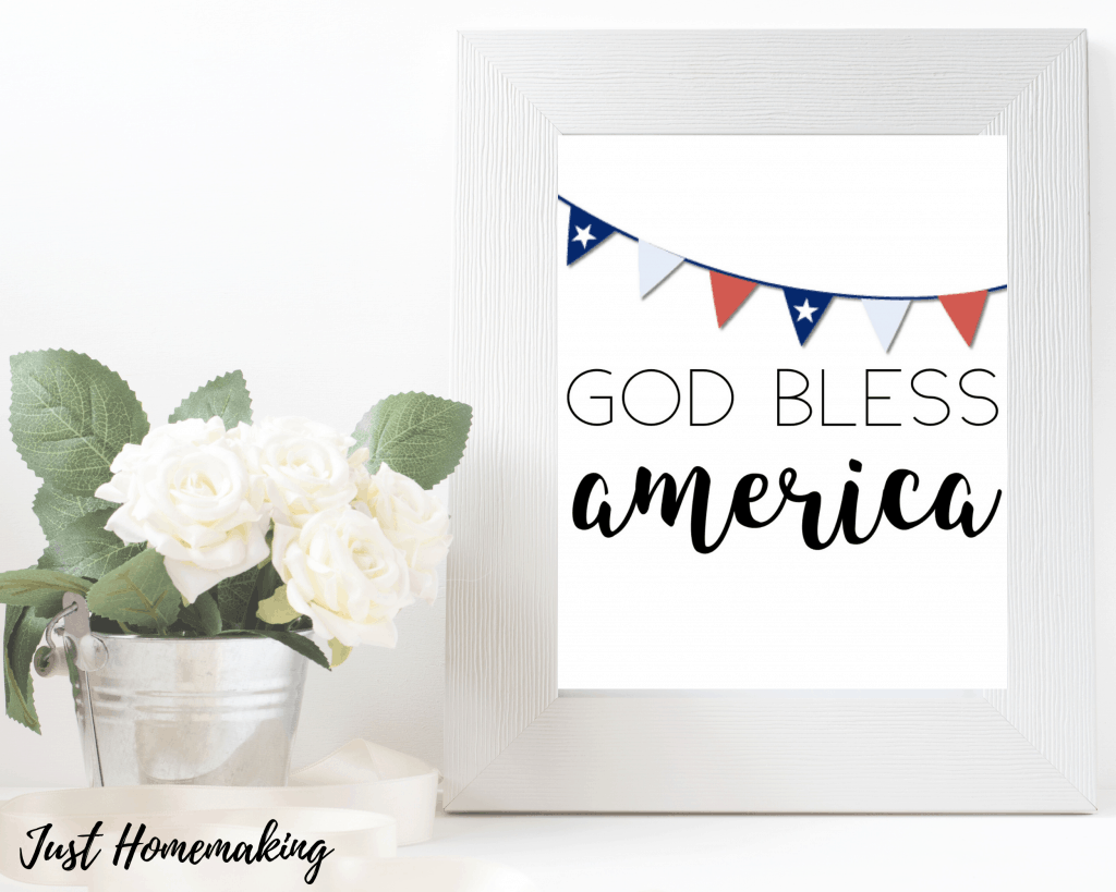 Independence Day wall art printable with a red, white, and blue banner that reads:
God Bless America