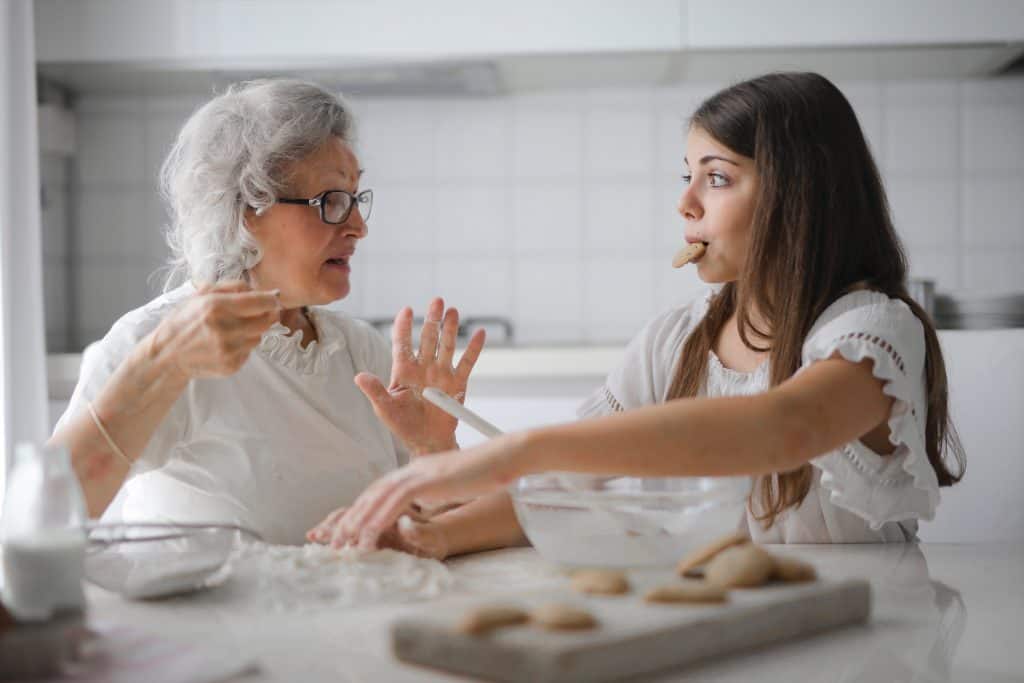 Grandma teaching homemaking skills to daughter