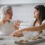 Grandma teaching homemaking skills to daughter