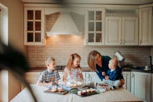 Homemaker in her kitchen with her three children