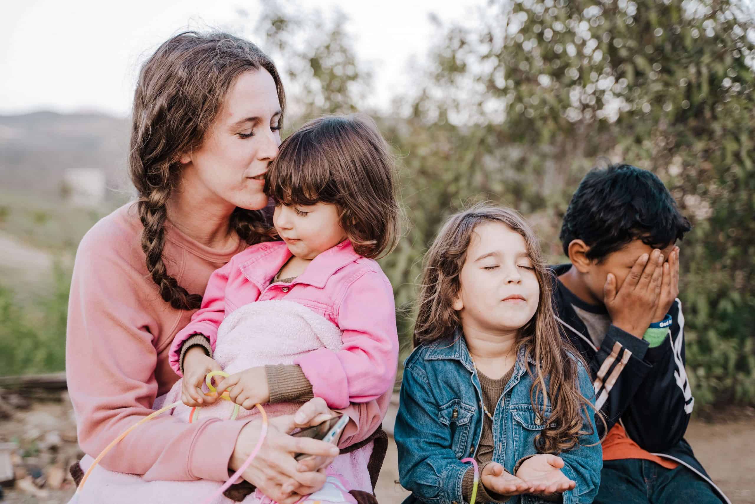 Mom with kids building a strong Christian family