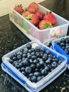 Food prepping berries in containers