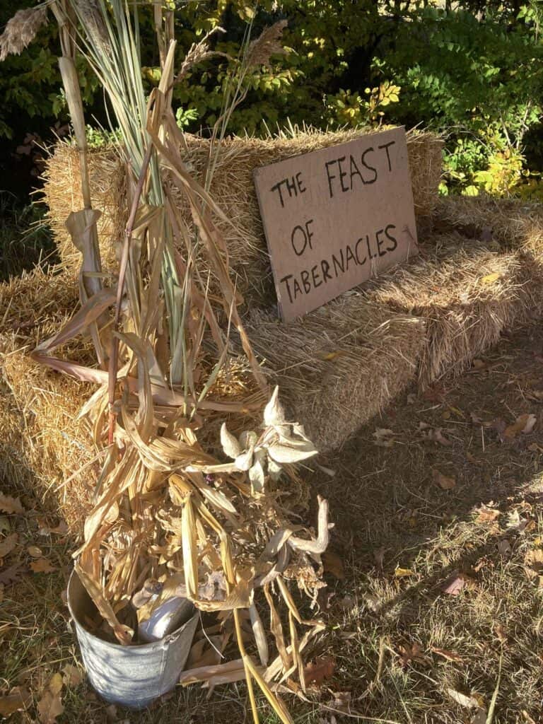 Feast of Tabernacles sign outside on bails of hay