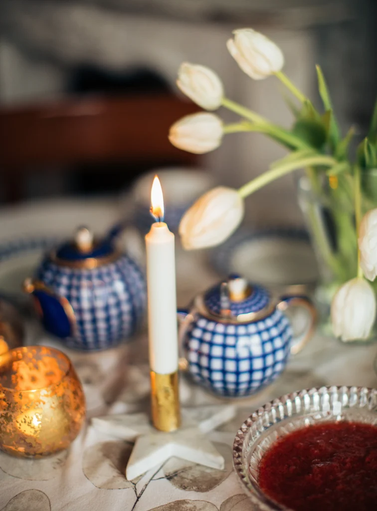 Table with candles and teapot for beautiful decor
