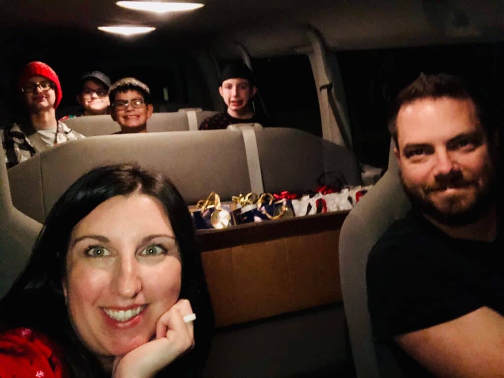 Ding Dong Ditch Christmas: Jenna from Just Homemaking with her family, loaded up in the van and preparing to Christmas Ding Dong Ditch their friends and neighbors