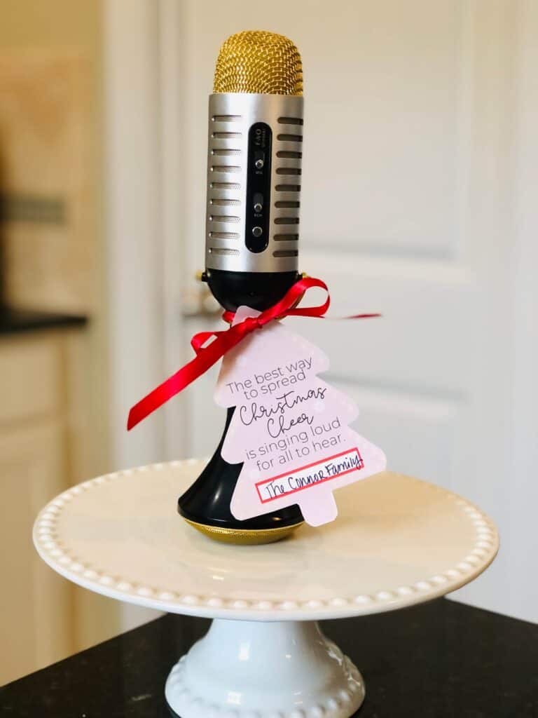 Christmas Ding Dong Ditch Idea from Just Homemaking: playlist or bluetooth karaoke microphone with gift tag "The best way to spread Christmas Cheer is singing loud for all to hear."