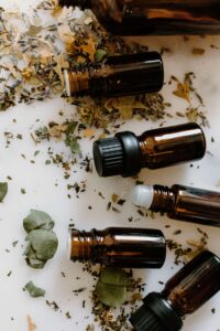 Bottles of essential oils and dried herbs