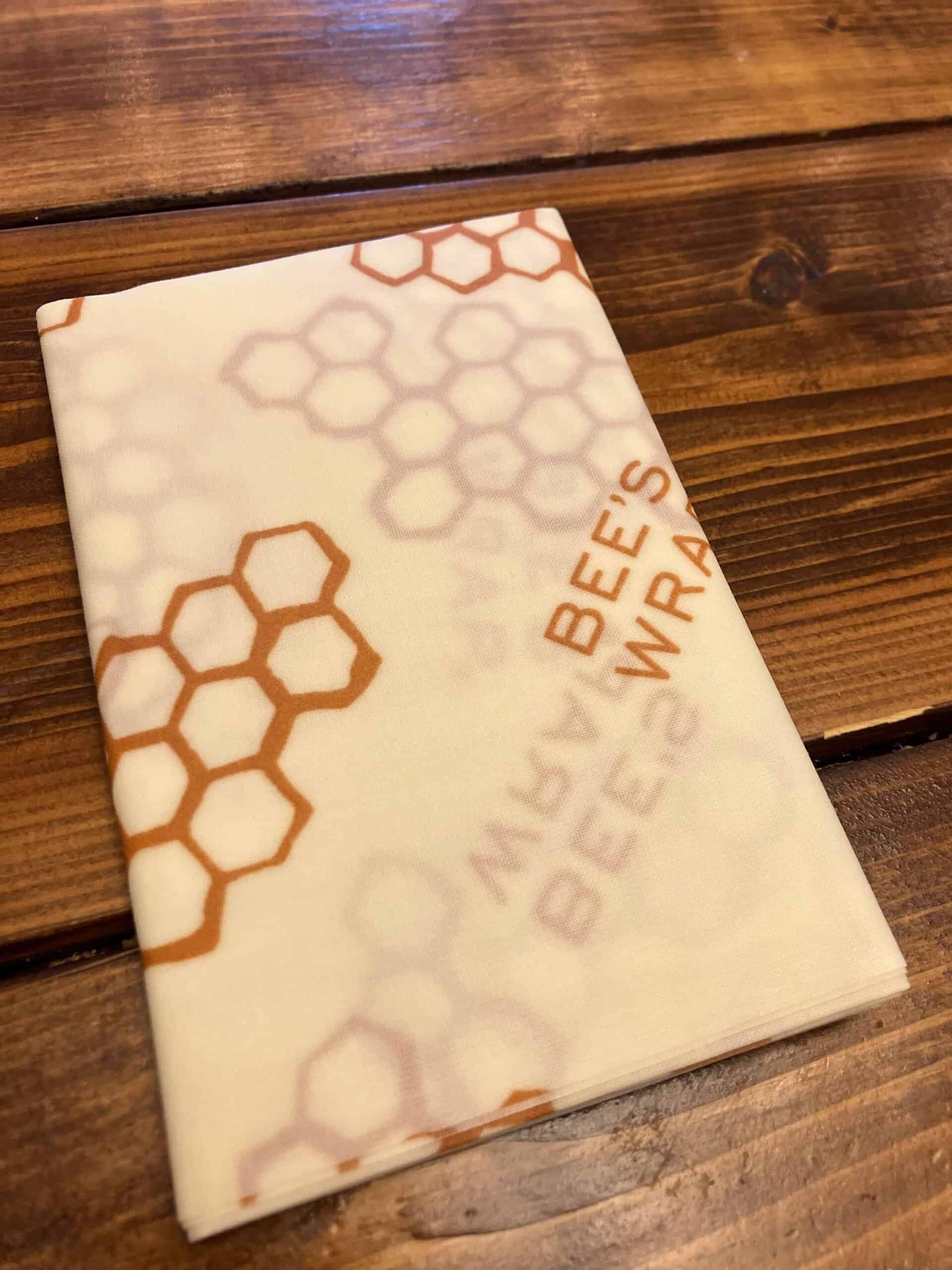 beeswax wrap folded on a wooden table