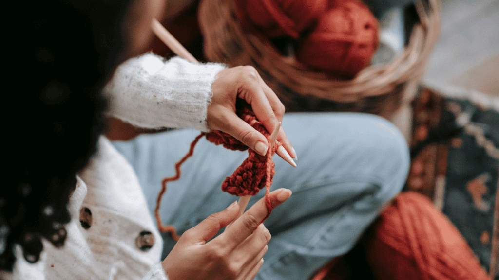 How to enjoy homemaking: be diligent about self care and hobbies. Woman crocheting.