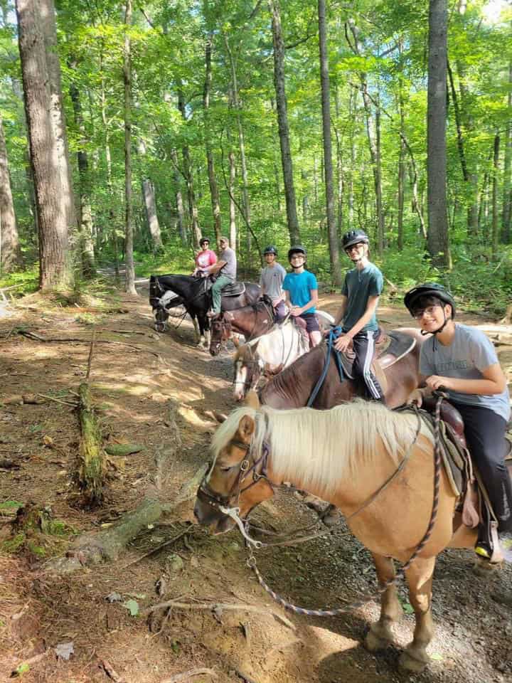 What no one tells you about raising teen boys" They're a lot of fun. (Mom and Dad trying horseback riding with their four sons for the first time.)