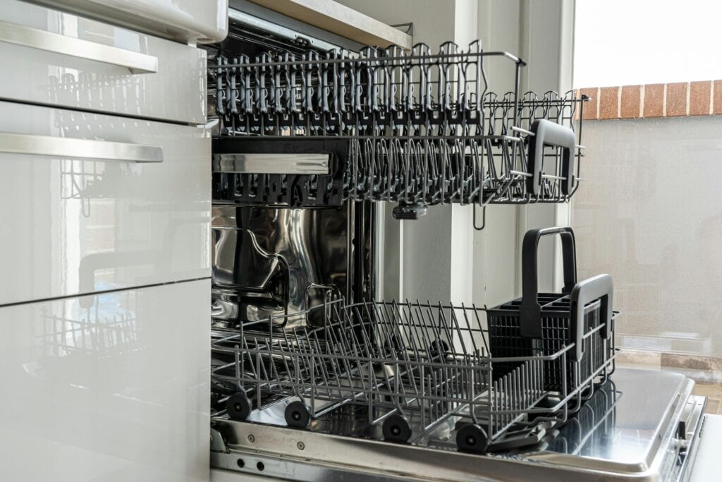 my morning cleaning routine: empty the dishwasher (dishwasher with top rack pulled out)