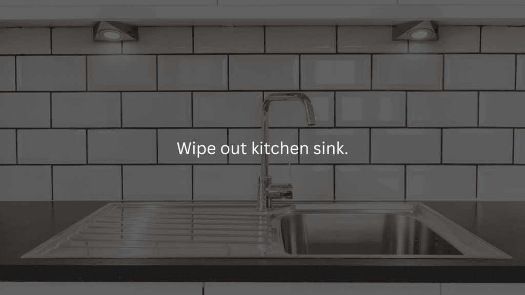 Nightly cleaning routine: wipe out kitchen sink. Clean kitchen sink with white backsplash.