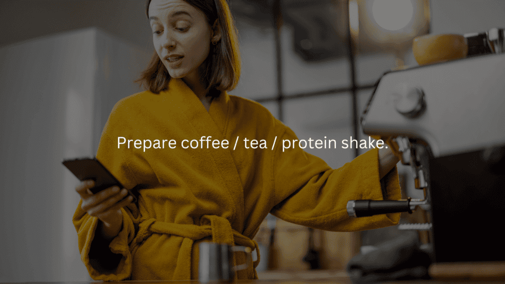 Nightly cleaning routine: prepare coffee/tea/protein shake. Woman in bathrobe preparing coffee and looking at cell phone.